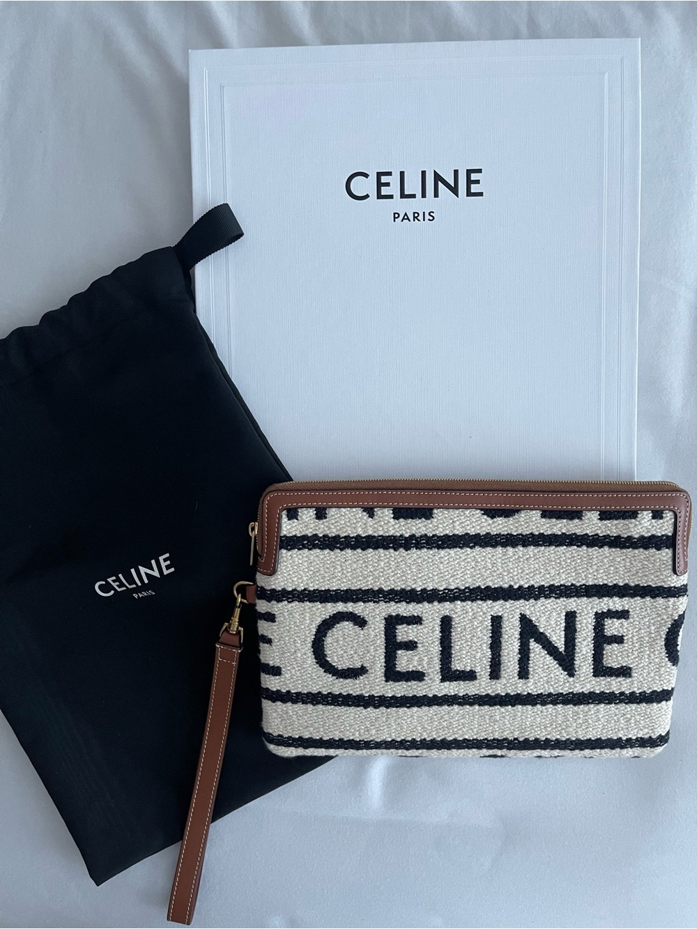 CELINE Striped Logo Canvas Wristlet in Black and Cream